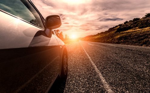 Car ride on road in sunny weather, motion blur